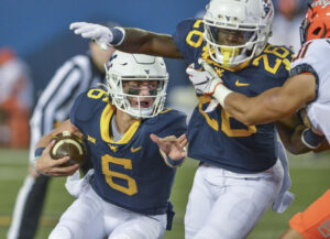 Quarterback battle wide open as WVU begins spring practice